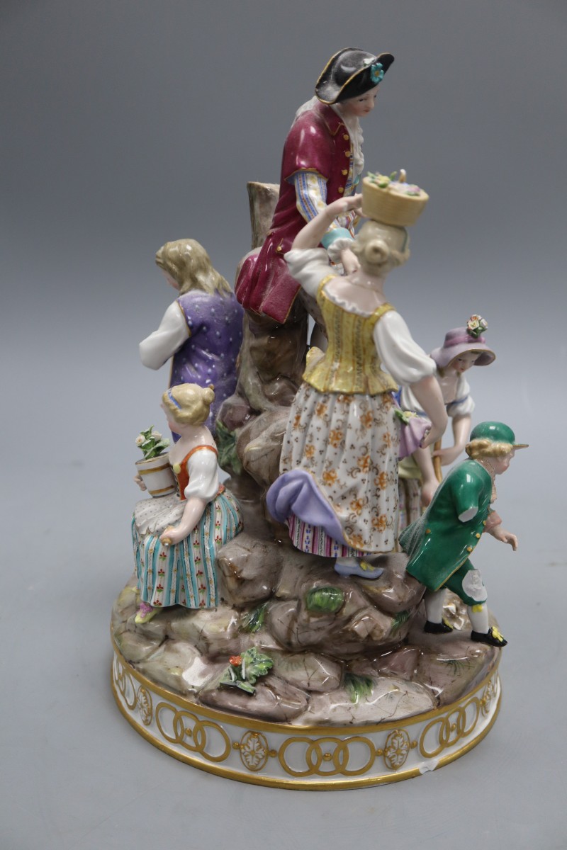 A 19th century Meissen gardening group, height 29cm, model D97